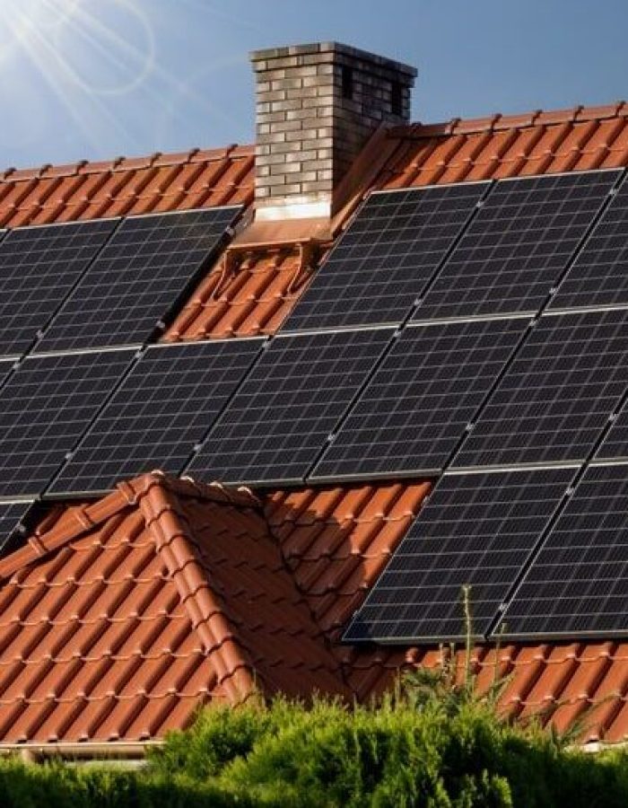 Black-solar-panels-on-a-tiled-roof-min