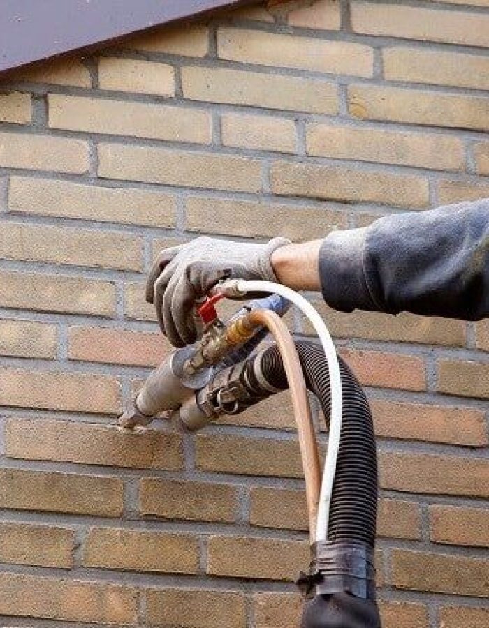 Installing-cavity-wall-insulation-1